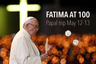Pope Francis leads the blessing of candles in the Chapel of the Apparitions at the Shrine of Our Lady of Fatima in Portugal, May 12. The Pope was making a two-day visit to Fatima to commemorate the 100th anniversary of the Marian apparitions and to canonize two of the young seers.