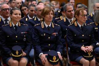 Members of the central anti-crime directorate of the Italian state police listen to Pope Francis during an audience in the Clementine Hall of the Apostolic Palace at the Vatican Nov. 26, 2022. The pope spoke to the officers about the importance of education, prevention and swift justice in fighting violence against women.