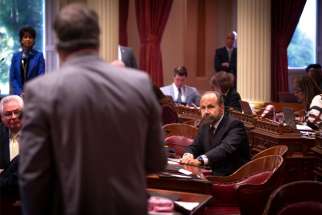 California state Sen. Jerry Hill, a Democrat, listens to another state legislator on the Senate floor at the California Capitol in Sacramento May 9, 2019. In a last-minute twist, a California bill that would have required priests to break the sacramental seal of confession was shelved July 8 by Hill amid a grassroots campaign mounted by the state&#039;s Catholics, members of other faith groups and religious liberty advocates from across the United States.