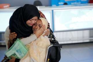 A woman greets her mother after she arrived from Dubai at John F. Kennedy International Airport in New York City Jan. 28. Three U.S. bishops&#039; committee chairmen expressed deep concern over religious freedom issues regarding president Donald Trump&#039;s refugee ban.