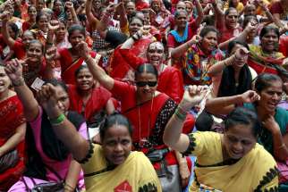 Workers from various trade unions shout slogans during an anti-government protest rally, organized as part of a nationwide strike, in Mumbai, India, Sept. 2.