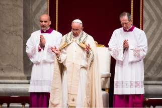 Pope Francis prays during first vespers of Divine Mercy Sunday in St. Peter&#039;s Basilica at the Vatican April 11. Before celebrating vespers, the pope released a 9,300-word document officially proclaiming the 2015-2016 extraordinary Holy Year of Mercy.