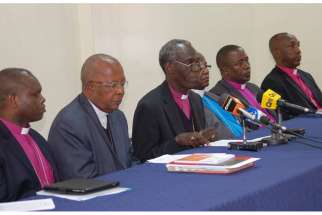 Kenyan church leaders, including Roman Catholic Cardinal John Njue, second left, and Anglican Archbishop Eliud Wabukala, third left, address a news conference at the All Saints Cathedral in Nairobi.