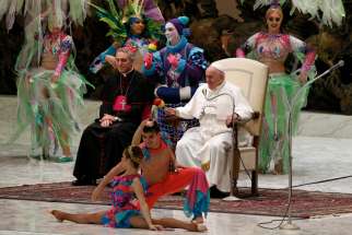 Pope Francis watches as the Aqua Circus performs during his general audience in Paul VI hall at the Vatican Jan. 8, 2020.