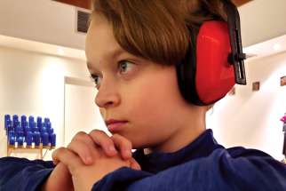 Debbie Frey’s son Dallas uses headphones to help deal with his sensory processing disorder.