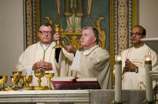 Toronto&#039;s Auxiliary Bishop William McGrattan (centre), who becomes bishop of Peterborough on June 23, celebrated his own farewell Mass at St. Paul&#039;s Basilica on June 20.