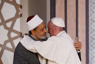 Pope Francis embraces Sheik Ahmad el-Tayeb, grand imam of al-Azhar University, at a conference on international peace in Cairo April 28. The Pope was making a two-day visit to Egypt.