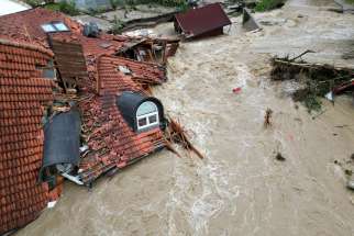 A view of a damaged building in a flooded area, following heavy rains, in Prevalje, Slovenia, August 6, 2023. Slovenia&#039;s Catholic bishops are calling for prayer and material support as floods have ravaged their nation in recent days, killing at least six and displacing thousands.