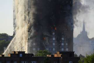  Flames and smoke billow from a London apartment building June 14. The death toll is at 79 as of June 18.