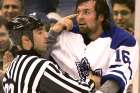 Angelo D’Amico separates former Toronto Maple Leaf Darcy Tucker from an opponent during his stint as an NHL linesman.