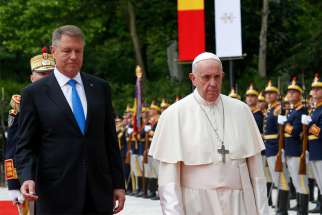 Pope Francis walks with President Klaus Iohannis of Romania during a welcoming ceremony at the entrance of the Cotroceni Palace in Bucharest, Romania, May 31, 2019. The pope is making a three-day visit to Romania.