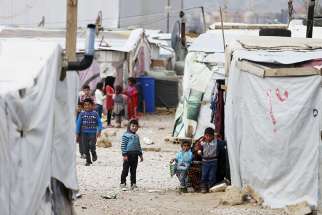  Syrian children are seen inside an informal settlement for refugees in Bar Elias, Lebanon.