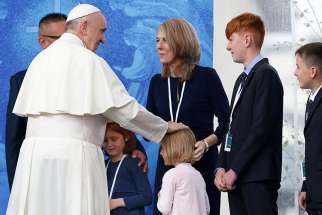 Pope Francis greets family members as he visits the Knock Shrine in Knock, Ireland, Aug. 26. 