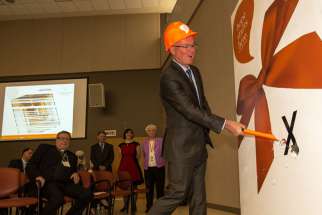 Providence Healthcare Foundation board member Andrew Branion symbolically inaugurates the renovation to Providence Healthcare’s palliative care wing April 2.