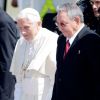 Pope Benedict XVI and President Raul Castro walk together after the pope&#039;s arrival in Santiago de Cuba, Cuba, March 26. The pope was beginning a three-day visit on the communist island.