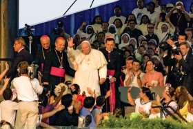 Pope John Paul II waves to the vast crowd that attended the vigil at Toronto’s Downsview Park during World Youth Day 2002. More than 800,000 attended the week-long event. 