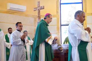 Archbishop Pierbattista Pizzaballa, apostolic administrator of the Latin Patriarchate of Jerusalem, celebrates Mass in Marj Al Haman, Jordan, July 23. 