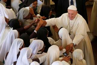 Pope Francis greets nuns after attending the recitation of midday prayer in the Discalced Carmelite Monastery in Antananarivo, Madagascar, Sept. 7, 2019.