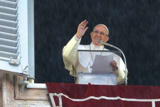 Rains falls as Pope Francis leads the Angelus from the window of his studio overlooking St. Peter&#039;s Square at the Vatican Nov. 1, the feast of All Saints. 