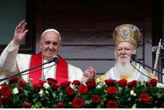  Pope Francis and Ecumenical Patriarch Bartholomew of Constantinople greet a small crowd after delivering a blessing in Istanbul Nov. 30. 2014.
