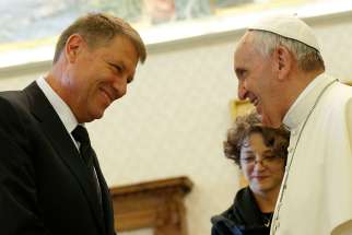 Pope Francis talks with Romanian President Klaus Iohannis during a private audience in the Apostolic Palace at the Vatican May 15. 