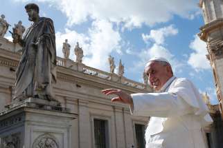 The statue of St. Peter is seen as Pope Francis leaves his general audience in St. Peter&#039;s Square at the Vatican March 14. 