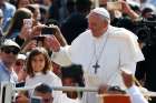 Children ride in the popemobile as Pope Francis greets the crowd during his general audience in St. Peter&#039;s Square at the Vatican May 22, 2019.