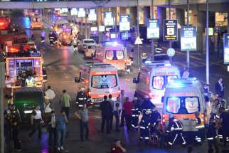Paramedics help people outside Istanbul&#039;s Ataturk Airport following a June 28 suicide attack. The bombings killed over 40 and wounded more than 230 as Turkish officials blamed the carnage at the international terminal on three suspected Islamic State group militants.