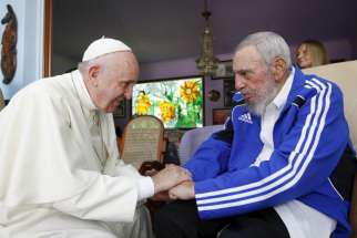 Pope Francis and former Cuban President Fidel Castro hold hands at Castro&#039;s residence in Havana Sept. 20, 2015. A new documentary, premiered Sept. 8, chronicle&#039;s the Pope&#039;s 2015 visit.