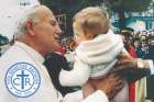 Pope John Paul II greets one of the young fans during his first visit to Canada in 1984.