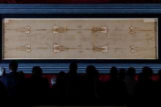 The Shroud of Turin is displayed at the Cathedral of St. John the Baptist in Turin, Italy, in 2015. St. Isidore’s parish in Ottawa will host the Man of the Shroud exhibit, with a replica of the Shroud, during Passion week.