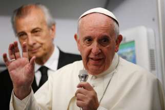 Pope Francis answers questions from journalists aboard his flight from Asuncion, Paraguay, to Rome July 12.