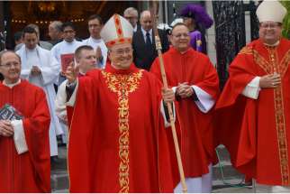 Cardinal Jaime Ortega of Havana waves after concelebrating Mass Sept. 14 at the Basilica-Cathedral Notre Dame de Quebec in Quebec City. 