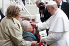 Pope Francis blesses a woman in a wheelchair during his general audience in St. Peter&#039;s Square at the Vatican May 29, 2019. 
