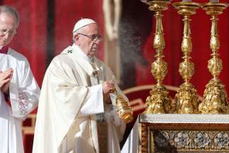 Pope Francis uses incense as he celebrates the canonization Mass for seven new saints in St. Peter&#039;s Square at the Vatican Oct. 16. 
