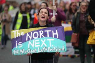 A woman displays a sign during a Sept. 28, 2019, rally in Dublin with other demonstrators who support abortion. Northern Ireland&#039;s Catholic and Protestant leaders said the British Parliament decided to impose abortion in Northern Ireland without consulting the people.