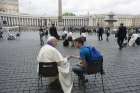Pope Francis hears confession of a youth April 23 in St. Peter&#039;s Square at the Vatican.