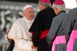 Pope Francis greets bishops during his general audience in St. Peter&#039;s Square at the Vatican Oct. 12.