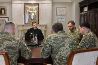 Major Archbishop Sviatoslav Shevchuk of Kyiv-Halych, head of the worldwide Ukrainian Greek Catholic Church, is seen in an April 2024 photograph with members of the Ukrainian military at the Patriarchal Cathedral complex in Kyiv. The major archbishop and the Ukrainian military officials discussed a range of issues, including Russia&#039;s detention of two Ukrainian Catholic priests whose fate remains unknown.