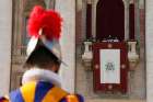 A Swiss Guard is seen as Pope Francis deliver his Christmas blessing &quot;urbi et orbi&quot; (to the city and the world) from the central balcony of St. Peter&#039;s Basilica at the Vatican Dec. 25.