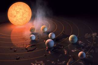 This artist&#039;s concept appeared on the February 23rd, 2017 cover of the journal Nature announcing that the TRAPPIST-1 star, an ultra-cool dwarf, has seven Earth-size planets orbiting it.