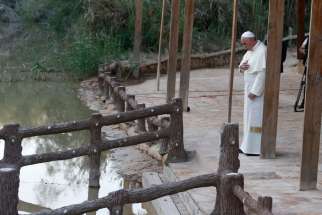 Pope Francis makes the Sign of the Cross in 2014 after praying at Bethany Beyond the Jordan, which UNESCO just declared a World Heritage site and the location of Jesus&#039; baptism.