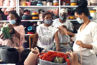 African women work in Kuchinate, the African Women Refugee collective, in Tel Aviv, Israel, July 14, 2020. The collective&#039;s work with asylum-seekers, supported by several Catholic charities, has become even more critical during the COVID-19 pandemic.