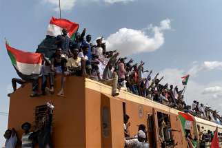People in Khartoum, Sudan, ride on the train Aug. 17, 2019, to join the celebrations of the signing of the Sudan&#039;s new power-sharing agreement. Catholic bishops in South Sudan praised the recent peace agreement for neighboring Sudan, which has experienced political turmoil since April.