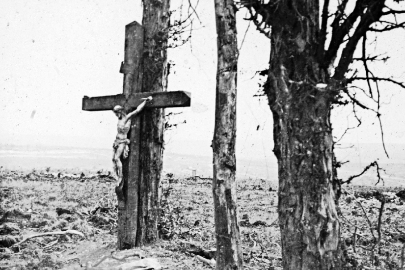 An archive picture shows a statue of Christ on the cross on a tree in Fricourt, France, during the First World War. 
