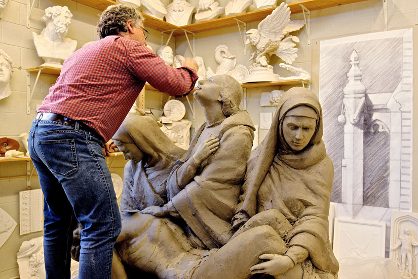 Lawrence Voaides works on the Pietà that will be placed above the Loretto sisters’ crypt. (Photo courtesy of Concrete Pictures Inc.)