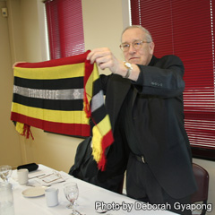 Gatineau Archbishop Roger Ebacher displays gifts from Sr. Clare Garcillano, a missionary in East Timor and a D&P partner.