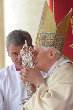 Pope Benedict XVI kisses a relic of Pope John Paul II as he celebrates the beatification Mass of his predecessor in St. Peter's Square at the Vatican May 1. 