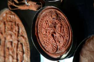 Wax seals of members of the English House of Lords are seen March 1, 2012, on a letter from the Vatican Secret Archives. Citing the negative misinterpretations that the word &quot;secret&quot; implies, Pope Francis has changed the name of the archives to the Vatican Apostolic Archives.