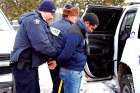 A man who told police he was from Mauritania in Africa is taken into custody by RCMP officers after walking across the U.S.-Canada border into Quebec. 